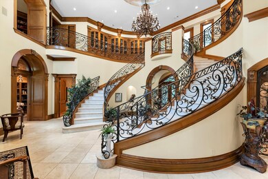 The curved staircases are adorned with beautiful w
