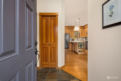 Step into this inviting foyer featuring beautiful slate floors and new paint throughout.