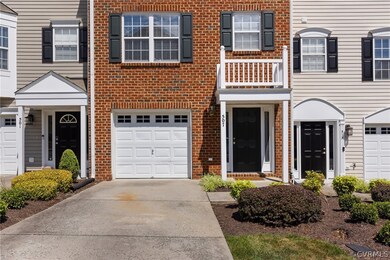 View of front facade featuring a garage