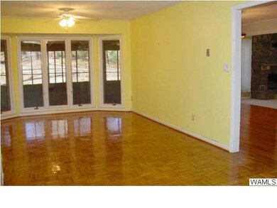Large breakfast area with hardwoods and wall of wi