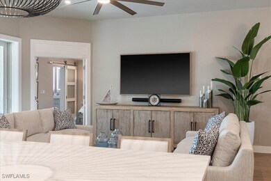Living room with a ceiling fan and wood finished f