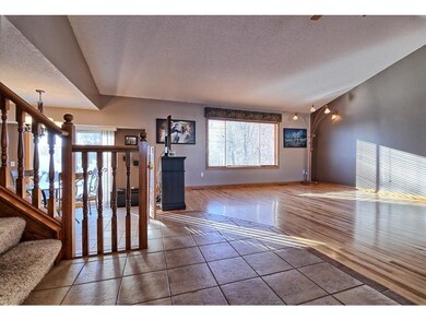 Great room with vaulted ceilings and solid wood hi