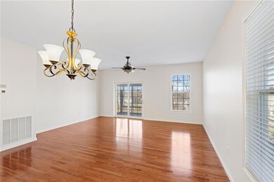 Open concept living/dining area with sliders to a