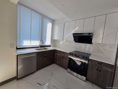 Kitchen featuring tasteful backsplash, modern cabinets, electric range oven, dark brown cabinetry, and recessed lighting