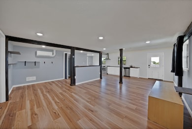 Basement with recessed lighting and light wood-style flooring