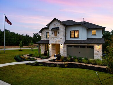 View of front of house featuring a shingled roof,