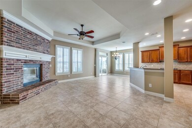 Beautiful corner fireplace, tray ceiling, and plan