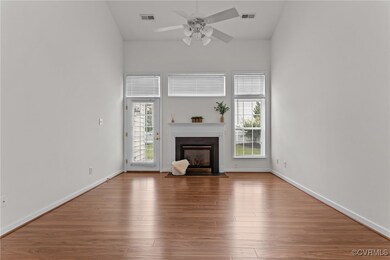 Unfurnished living room featuring a glass covered