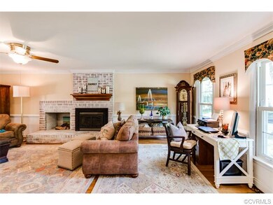 The great room to the right of the entryway runs t