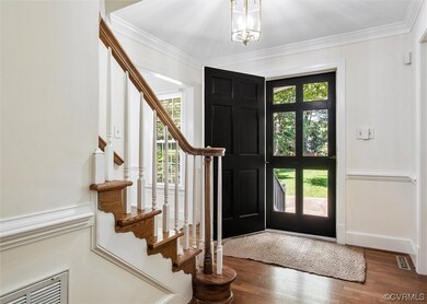 Bright foyer with hardwoods and newly refinished h