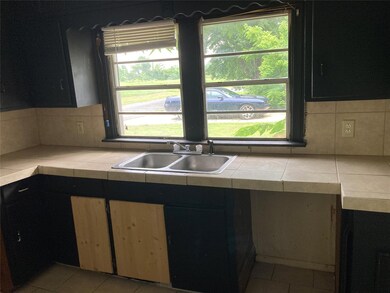 Kitchen with a wealth of natural light, sink, ligh