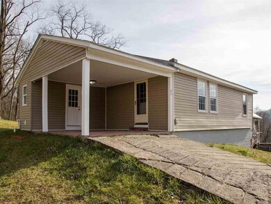 The front view of the home features a concrete dri