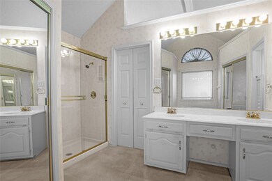Masterbath with shower and his and her closets