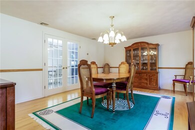 Dining room with hardwood and french doors that le