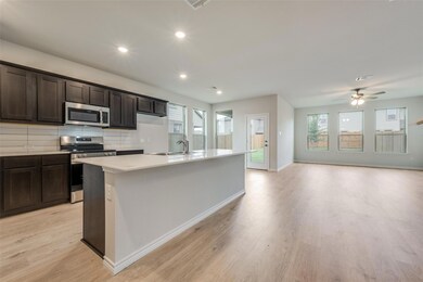 Kitchen featuring tasteful backsplash, an island w