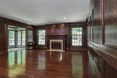 Oak Paneled Family Room with Fireplace Mantle and 