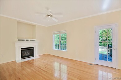 Hardwood flooring, door to deck, television nook,