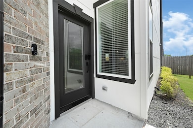 Charming covered entry with modern curb appeal—wel