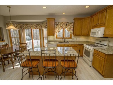 Sunny kitchen with island breakfast bar.