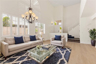 Living room featuring wood finished floors, a chan