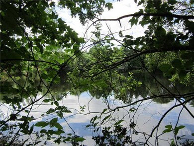 View. Lot abutts small pond and wooded area.