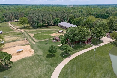Overview of rural landscape featuring a heavily wo
