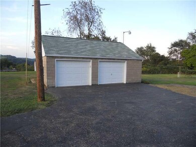Exterior Front. Large detached 2-car garage!