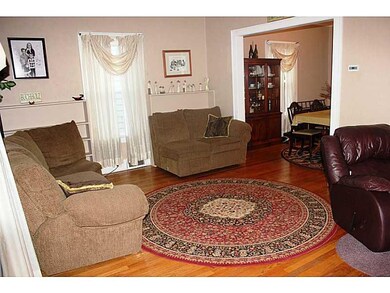 Living Room. Spacious LR! Exposed Hardwood floorin