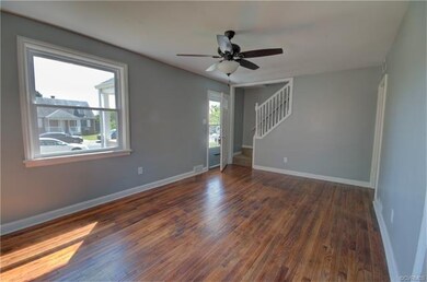 Living Room  10 x 16 has Hardwood Floors, Ceiling Fan with Light