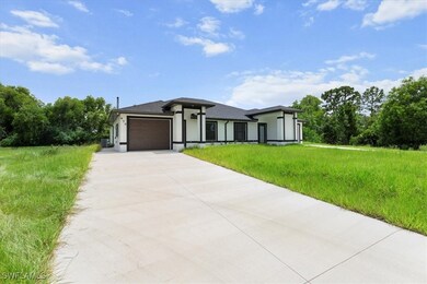 Prairie-style house featuring concrete driveway, a