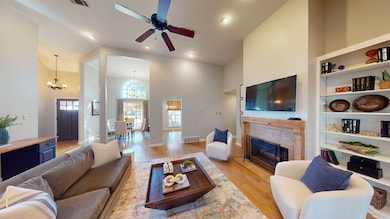 Living room with light hardwood / wood-style floor