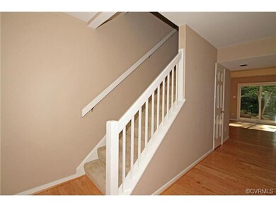 The foyer has new hardwood floor, recessed lights,