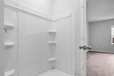 Full bathroom featuring baseboards, wood finished 