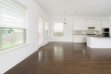 Kitchen with stainless steel appliances, dark cou