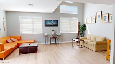 Living area featuring visible vents, baseboards, a