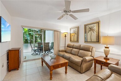 Living room with sliding glass doors to screened i