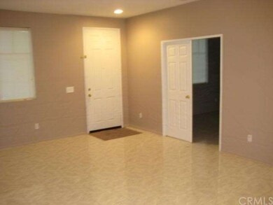 View of front door and Den or room that can be use