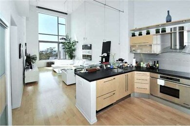The kitchen enjoys top quality appliances, black granite surfaces and a glass-faced SubZero!