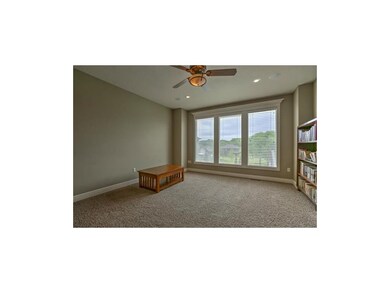 Wall of windows in Great Room on main level.