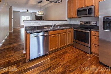 Kitchen overlooks in to dining area.