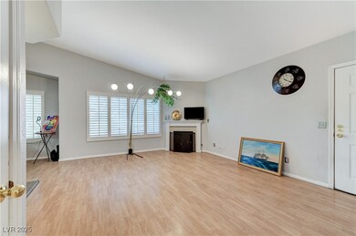 Unfurnished living room featuring wood finished fl