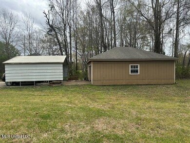 Daves cir workshop and carport side view