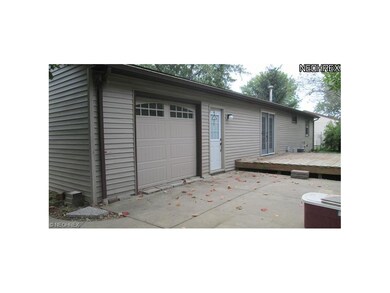 this garage door is in the rear of the house with 