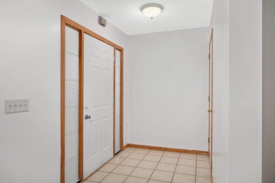 Welcoming foyer with large coat closet