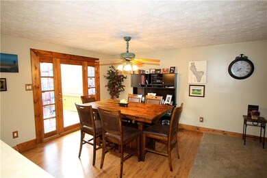 Formal 13x11 Dining Room w/ Wood Trim Glass Door o