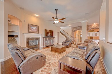 To the left of the gas log fireplace is one of the many custom built-ins the home has to offer. This home lends itself to entertaining family and friends.