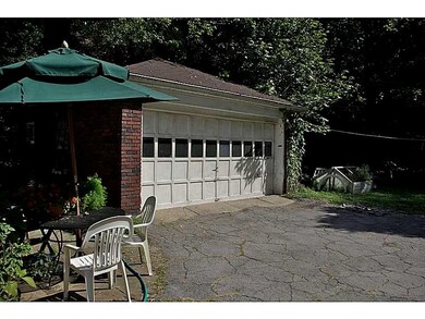 Parking Lot/Garage. Driveway leads to 2 Car Garage