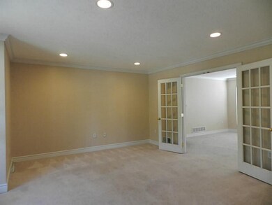 Living Room. French doors from living room to fami