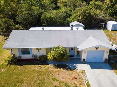 Aerial view of house with nature preserve in the b