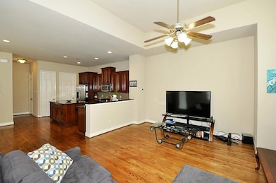 Living area is open to kitchen for easy entertaini